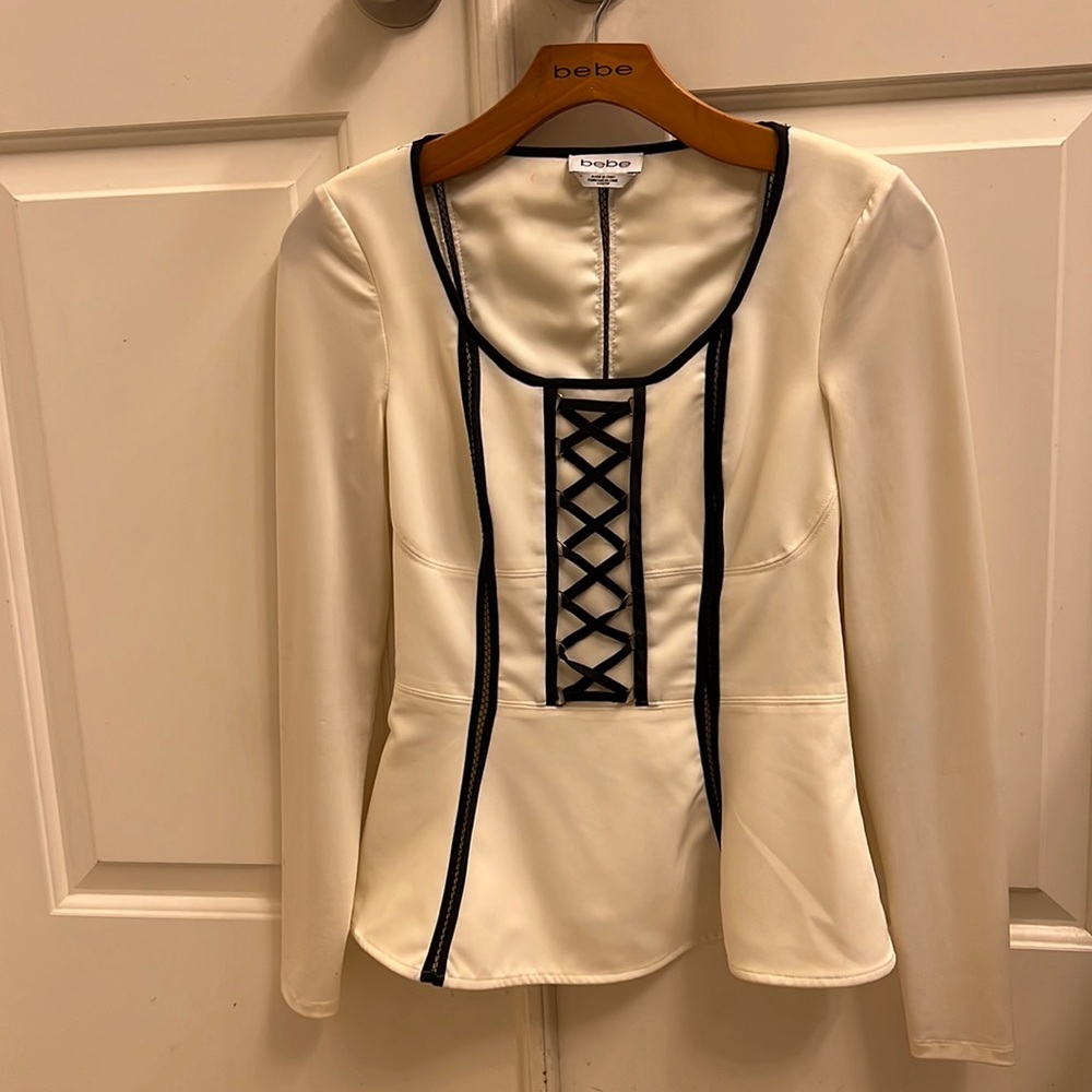 Bebe peplum top .